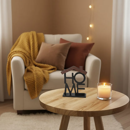 Decorative piece with 'HOME' on a wooden table against a gray background