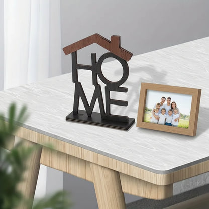 Decorative piece with 'HOME' on a table