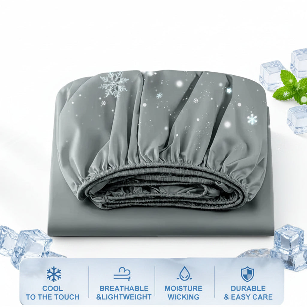 A folded gray sleep sheet or fitted sheet with elasticized edges, shown on a light icy background with decorative snowflakes, ice cubes, mint leaves, and feature icons along the bottom.