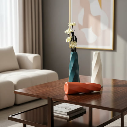 Three colorful vases on a surface with a neutral background